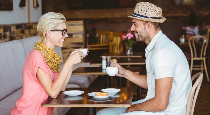 couple talking and drinking coffee