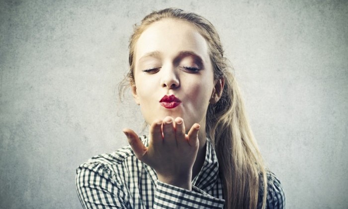 girl kissing with closed eyes