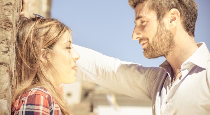 man picking up woman