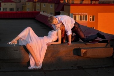 Young Couple On The Roof