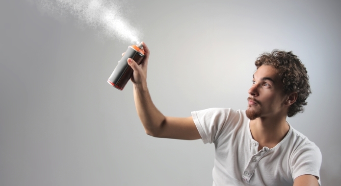 man using spray