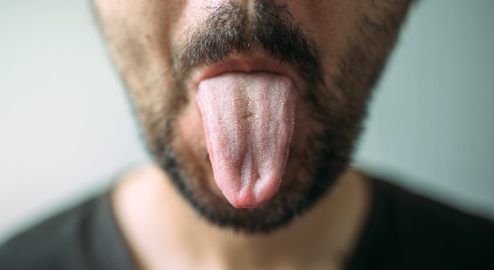 man sticking out tongue